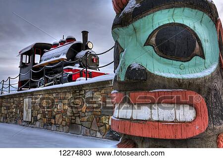 Totem Pole and Train at the Alaska Railroad Depot in Anchorage, Southcentral Alaska, HDR View Large Photo Image Stock Image - Totem Pole and Train at the Alaska Railroad Depot in Anchorage, Southcentral Alaska, HDR. Fotosearch