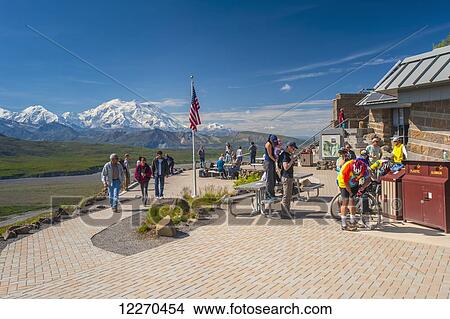 Picture - Tourist at Eielson Visiter Center are enjoying the scenery on a sunny summer day with Mt. Mckinley in the background, Interior Alaska. Fotosearch