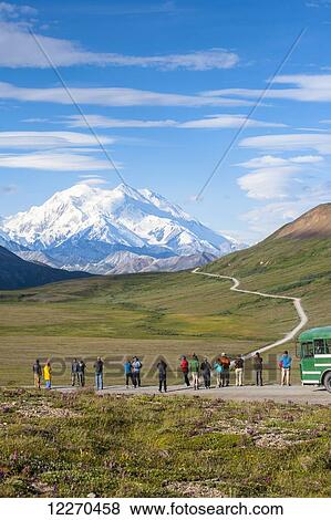 Stock Photo - Tourist viewing Mt. McKinley from Stony Hill Overlook, Denali National Park, Interior Alaska. Fotosearch