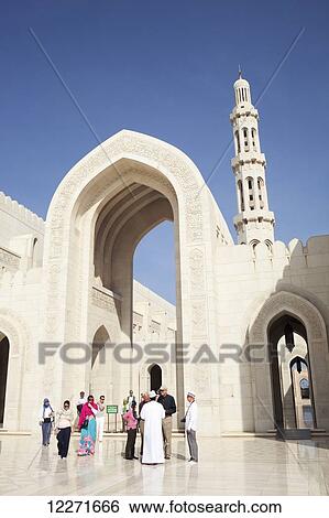Stock Photograph - Tourists at Sultan Qaboos Grand Mosque; Muscat, Oman. Fotosearch