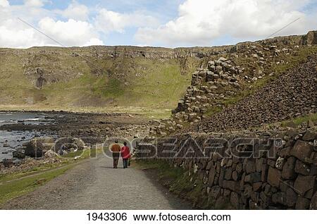 Tourists At The Giant's Causeway, Northern Ireland, United Kingdom View Large Photo Image Stock Photograph - Tourists At The Giant's Causeway, Northern Ireland, United Kingdom. Fotosearch