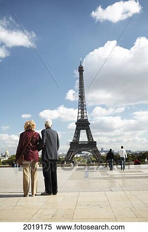 Tourists In Front Of The Eiffel Tower, Paris, France View Large Photo Image Stock Photography - Tourists In Front Of The Eiffel Tower, Paris, France. Fotosearch