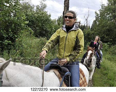Tourists on a trail ride in Far North Bicennentenial Park Anchorage, Southcentral Alaska View Large Photo Image Stock Image - Tourists on a trail ride in Far North Bicennentenial Park Anchorage, Southcentral Alaska. Fotosearch