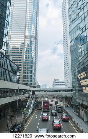 Traffic and skyscraper office buildings in Central district; Hong Kong, China View Large Photo Image Stock Image - Traffic and skyscraper office buildings in Central district; Hong Kong, China. Fotosearch