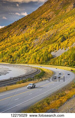 Stock Photo - Traffic on the Seward Highway along Turnagain Arm section of the Cook Inlet on a Fall day in South Central Alaska, HDR. Fotosearch