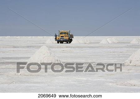 Truck Collecting Salt From Piles Of Salt At The Salar De Uyuni, The World's Largest Salt Flat, Potosi Department, Bolivia View Large Photo Image Stock Photo - Truck Collecting Salt From Piles Of Salt At The Salar De Uyuni, The World's Largest Salt Flat, Potosi Department, Bolivia. Fotosearch