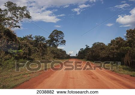 Stock Image - Truck On A Red Dirt Road Between Concepci. Fotosearch
