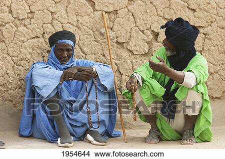 Tuareg men in front of the Djingareyber Mosque, Timbuktu, Mali View Large Photo Image Picture - Tuareg men in front of the Djingareyber Mosque, Timbuktu, Mali. Fotosearch