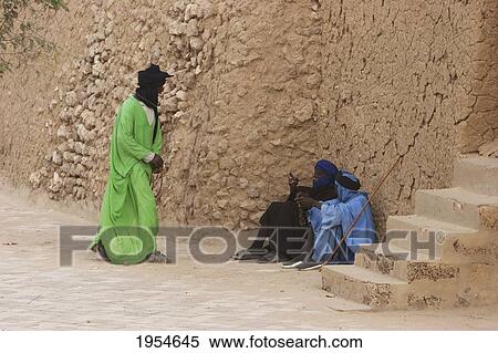 Tuareg men in front of the Djingareyber Mosque, Timbuktu, Mali View Large Photo Image Stock Photography - Tuareg men in front of the Djingareyber Mosque, Timbuktu, Mali. Fotosearch