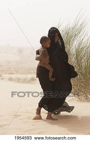 Tuareg woman on a sand dune near Timbuktu, Mali View Large Photo Image Stock Image - Tuareg woman on a sand dune near Timbuktu, Mali. Fotosearch