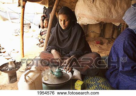 Tuareg woman preparing mint tea in Tiriken, Mali View Large Photo Image Stock Photograph - Tuareg woman preparing mint tea in Tiriken, Mali. Fotosearch