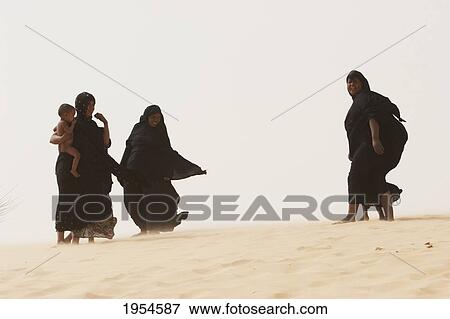 Stock Photo - Tuareg women and children on a sand dune near Timbuktu, Mali. Fotosearch
