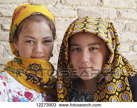 Stock Image - Turkmen girls, Meane Baba Mausoleum, near Abiverd; Turkmenistan. Fotosearch