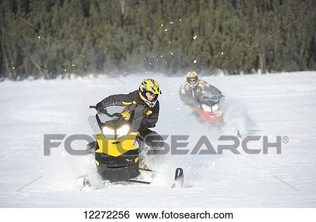 Two friends snowmachine through fresh snow on Little Harding Lake in Harding Lake State Recreation Area 45 miles south of Fairbanks in Interior Alaska. View Large Photo Image Stock Photograph - Two friends snowmachine through fresh snow on Little Harding Lake in Harding Lake State Recreation Area 45 miles south of Fairbanks in Interior Alaska.. Fotosearch