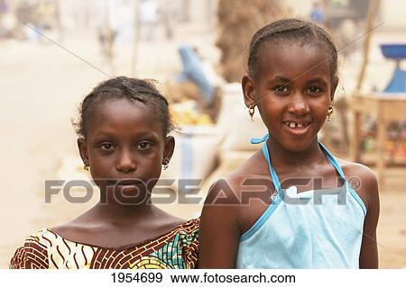 Stock Photo - Two girls in Segou, Mali. Fotosearch