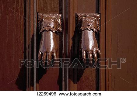 Two hands as door handles on a door; Vejer de la Frontera, Andalusia, Spain View Large Photo Image Stock Photograph - Two hands as door handles on a door; Vejer de la Frontera, Andalusia, Spain. Fotosearch