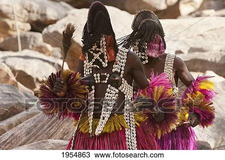Stock Image - Two people wearing Kananga masks perform at the Dama celebration in Tireli, Mali. Fotosearch