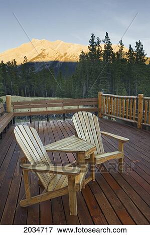 Stock Photo - Two Wooden Chairs At Aurum Lodge A Solar Energy Powered Lodge In The Canadian Rockies, Kootenay Plains, Bighorn Wildlands, Alberta. Fotosearch