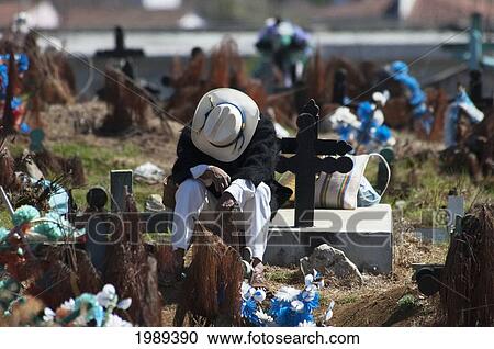 Tzotzil Maya Man Sitting On A Grave In The Cemetery Of San Juan Chamula, Chiapas, Mexico View Large Photo Image Stock Image - Tzotzil Maya Man Sitting On A Grave In The Cemetery Of San Juan Chamula, Chiapas, Mexico. Fotosearch