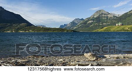 Upper Waterton Lake and mountains with Prince of Wales Hotel, Waterton Lakes National Park; Alberta, Canada View Large Photo Image Stock Photograph - Upper Waterton Lake and mountains with Prince of Wales Hotel, Waterton Lakes National Park; Alberta, Canada. Fotosearch