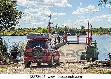 Stock Photo - Vehicle sitting at the river crossing, near Cebollati; Uruguay. Fotosearch