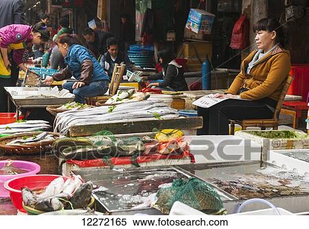Vendors and shoppers at Bashi market; Xiamen, Fujian province, China View Large Photo Image Stock Photography - Vendors and shoppers at Bashi market; Xiamen, Fujian province, China. Fotosearch