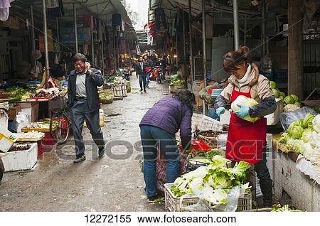 Vendors and shoppers at the Bashi Market; Xiamen, Fujian province, China View Large Photo Image Stock Photography - Vendors and shoppers at the Bashi Market; Xiamen, Fujian province, China. Fotosearch