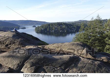 Stock Photograph - View from Quarry Rock, hike up from Deep Cove, North Vancouver, looking out over Indian Arm; Vancouver, British Columbia, Canada. Fotosearch
