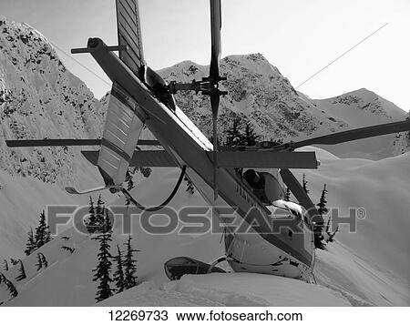 View from the rear of a helicopter landed on snow high in the mountains above Haines, Southeast Alaska View Large Photo Image Stock Image - View from the rear of a helicopter landed on snow high in the mountains above Haines, Southeast Alaska. Fotosearch