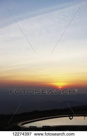 Stock Photo - View of swimming pool, Ngorongoro Sopa Lodge in the Serengeti National Park; Bariadi, Tanzania. Fotosearch