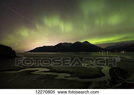 View of the Aurora Borealis (Northern Lights) dancing above the Chugach Mountains and Turnagain Arm, Southcentral Alaska, Winter View Large Photo Image Stock Photography - View of the Aurora Borealis (Northern Lights) dancing above the Chugach Mountains and Turnagain Arm, Southcentral Alaska, Winter. Fotosearch