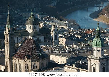 View of the city from the castle, including the bell tower of the Franciscan church, the Cathedral and the river Salzach; Salzburg, Austria View Large Photo Image Stock Photo - View of the city from the castle, including the bell tower of the Franciscan church, the Cathedral and the river Salzach; Salzburg, Austria. Fotosearch