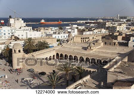 Stock Image - View of the Grand Mosque and port, seen from the Ribat; Sousse, Tunisia. Fotosearch