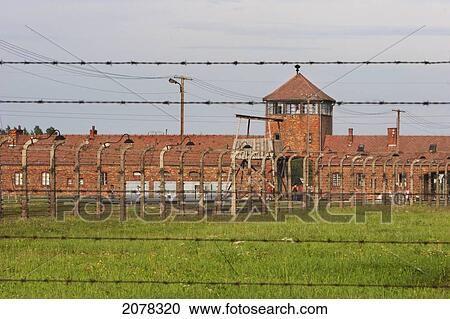 View Of The Main Guard House Through The Electrified Barbed Wire Fence, Auschwitz-Birkenau Concentration Camp, Oswiecim, Malopolska, Poland View Large Photo Image Stock Image - View Of The Main Guard House Through The Electrified Barbed Wire Fence, Auschwitz-Birkenau Concentration Camp, Oswiecim, Malopolska, Poland. Fotosearch