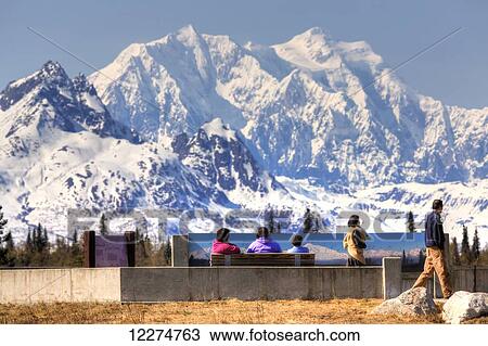 Visitors enjoying the view of Mt. Hunter and the Alaska Range at Denali Viewpoint South along the Parks Highway, Denali State Park, Spring, Southcentral, Alaska, HDR View Large Photo Image Stock Image - Visitors enjoying the view of Mt. Hunter and the Alaska Range at Denali Viewpoint South along the Parks Highway, Denali State Park, Spring, Southcentral, Alaska, HDR. Fotosearch