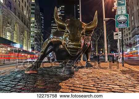 Stock Photo - Wall Street bull at nighttime, Bowling Green; New York City, New York, United States of America. Fotosearch