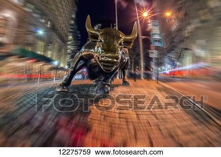 Stock Photo - Wall Street bull at nighttime, Bowling Green; New York City, New York, United States of America. Fotosearch