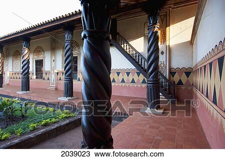 Stock Image - Walls With Frescoes With Tropical Motifs And Carved Wooden Columns Surrounding The Courtyard, Jesuit Mission Of Concepcion, Santa Cruz Department, Bolivia. Fotosearch