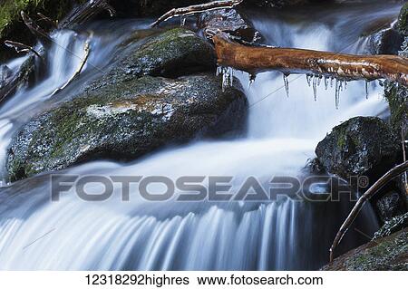 Stock Photograph - Waterfall with ice in the rainforest along the Herring Cove trail, near Sitka; Alaska, United States of America. Fotosearch