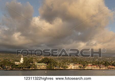 Waterfront at sunset, with historic Hulihee Palace and Mokuaikaua Church at the left; Kailua-Kona, Island of Hawaii, Hawaii, United States of America View Large Photo Image Stock Photograph - Waterfront at sunset, with historic Hulihee Palace and Mokuaikaua Church at the left; Kailua-Kona, Island of Hawaii, Hawaii, United States of America. Fotosearch