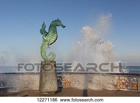 Waves splash behind The Boy on the Seahorse (Little Seahorse) statue on the Malecon; Puerto Vallarta, Mexico View Large Photo Image Stock Photograph - Waves splash behind The Boy on the Seahorse (Little Seahorse) statue on the Malecon; Puerto Vallarta, Mexico. Fotosearch