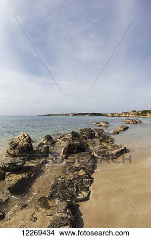 Picture - Wet rocks along the mediterranean coast; Peyia, Paphos, Cyprus. Fotosearch