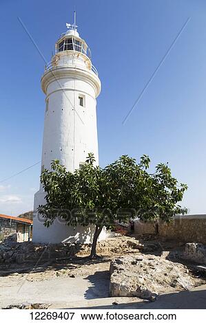 White lighthouse against a blue sky; Paphos, Cyprus View Large Photo Image Stock Photo - White lighthouse against a blue sky; Paphos, Cyprus. Fotosearch