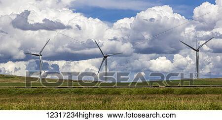Wind turbines on a field with train tracks, with cloud; Pincher Creek, Alberta, Canada View Large Photo Image Stock Photograph - Wind turbines on a field with train tracks, with cloud; Pincher Creek, Alberta, Canada. Fotosearch