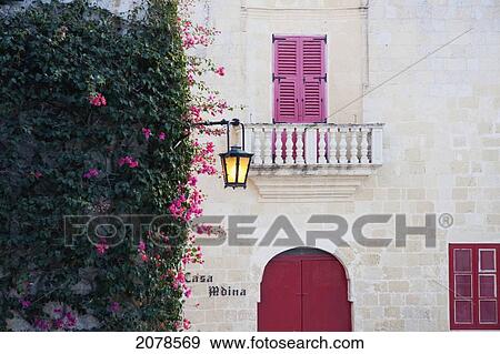 Windows And Street Lamp At Dusk, Mdina, Malta View Large Photo Image Stock Photo - Windows And Street Lamp At Dusk, Mdina, Malta. Fotosearch