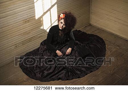Stock Image - Woman dressed in gothic theme; Pittsboro, North Carolina, USA. Fotosearch