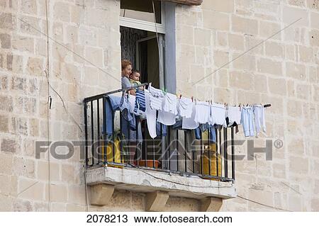 Woman Holding A Boy By A Balcony, Valletta, Malta View Large Photo Image Stock Image - Woman Holding A Boy By A Balcony, Valletta, Malta. Fotosearch