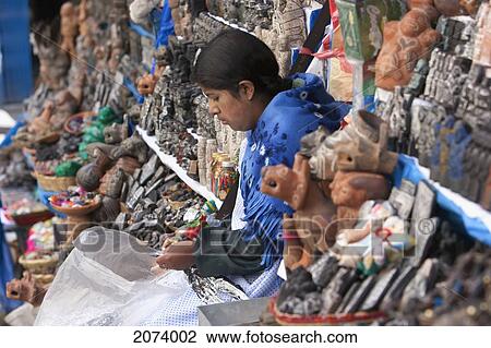 Woman Preparing An Offering Used In Ancient Inca Rites To Bring Good Luck Or The Good Will Of The Goddess Pachamama (Mother Earth) To Sell At The Mercado De Las Brujas (Witches' Market) On Calle Linares In La Paz., La Paz Department, Bolivia View Large Photo Image Stock Image - Woman Preparing An Offering Used In Ancient Inca Rites To Bring Good Luck Or The Good Will Of The Goddess Pachamama (Mother Earth) To Sell At The Mercado De Las Brujas (Witches' Market) On Calle Linares In La Paz., La Paz Department, Bolivia. Fotosearch