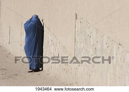 Picture - Woman Wearing A Burqa On A Kabul Street,, Afghanistan. Fotosearch