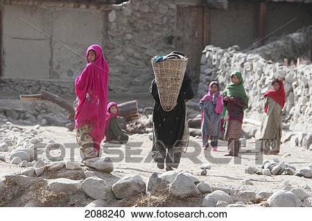 Women Carrying Baskets On Their Backs And Children, Ghwari, Northern Areas, Pakistan View Large Photo Image Stock Image - Women Carrying Baskets On Their Backs And Children, Ghwari, Northern Areas, Pakistan. Fotosearch